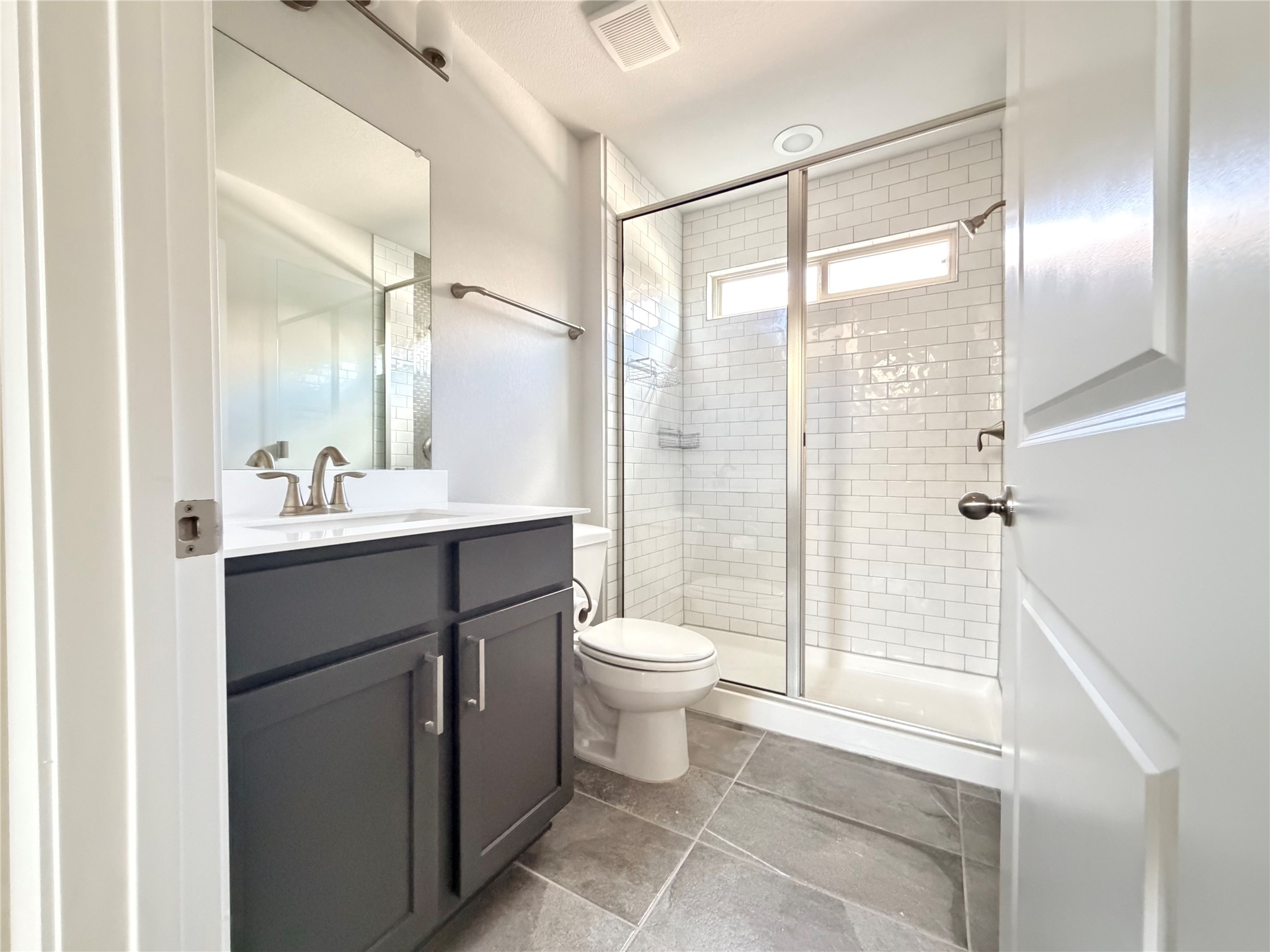 2813 Hopi Path, Unit 11 Leander, TX 78641 - Photo 4 of 17 Bathroom featuring vanity and a shower stall