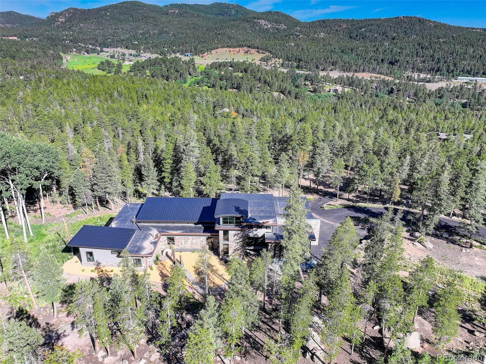 11505 Conifer Ridge Drive Conifer, CO 80433 - Photo 1 of 1 a view of a house with a yard