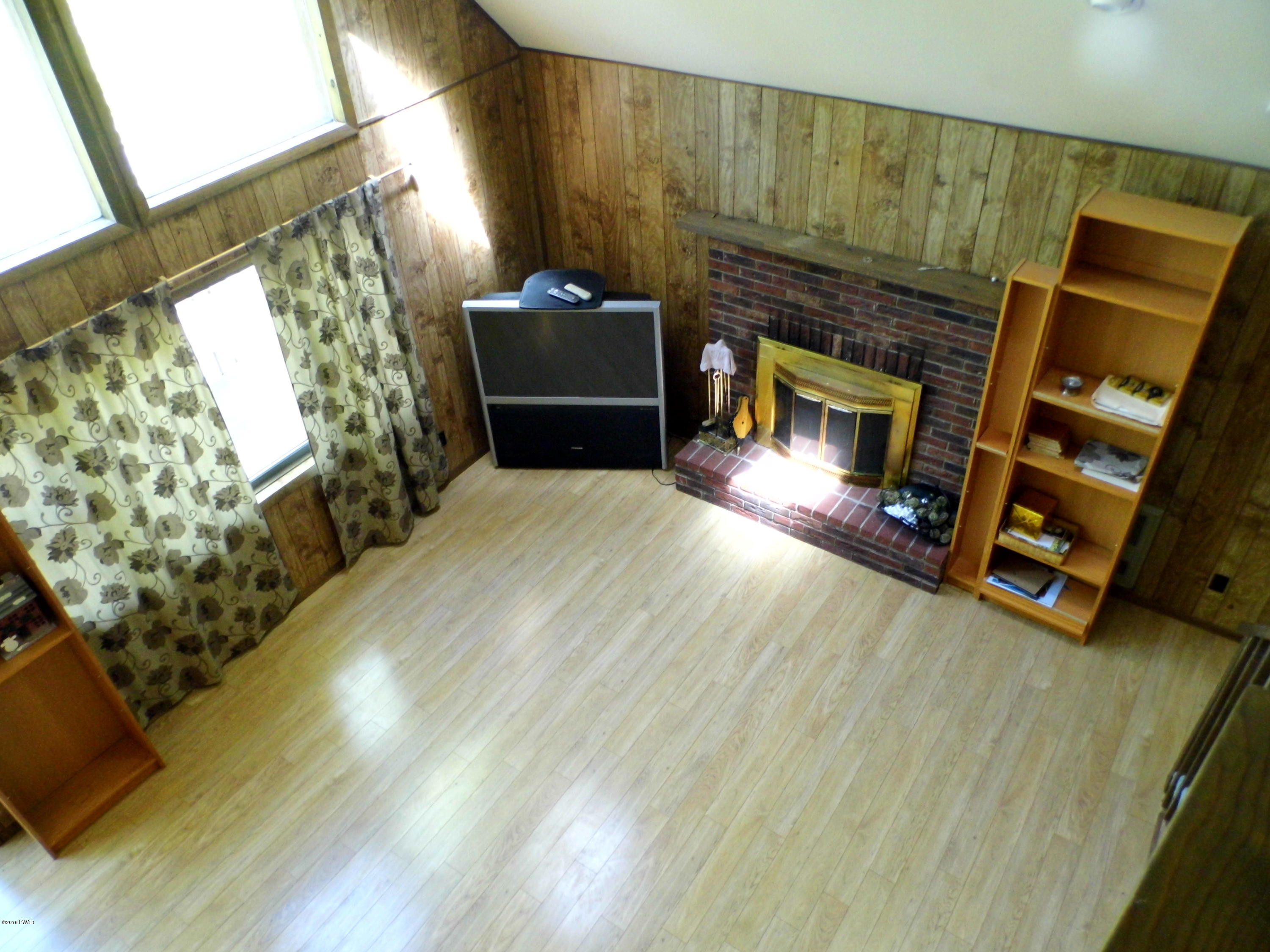 3081 Northgate Road Lake Ariel, PA 18436 - Photo 2 of 9 a living room with furniture and a fireplace