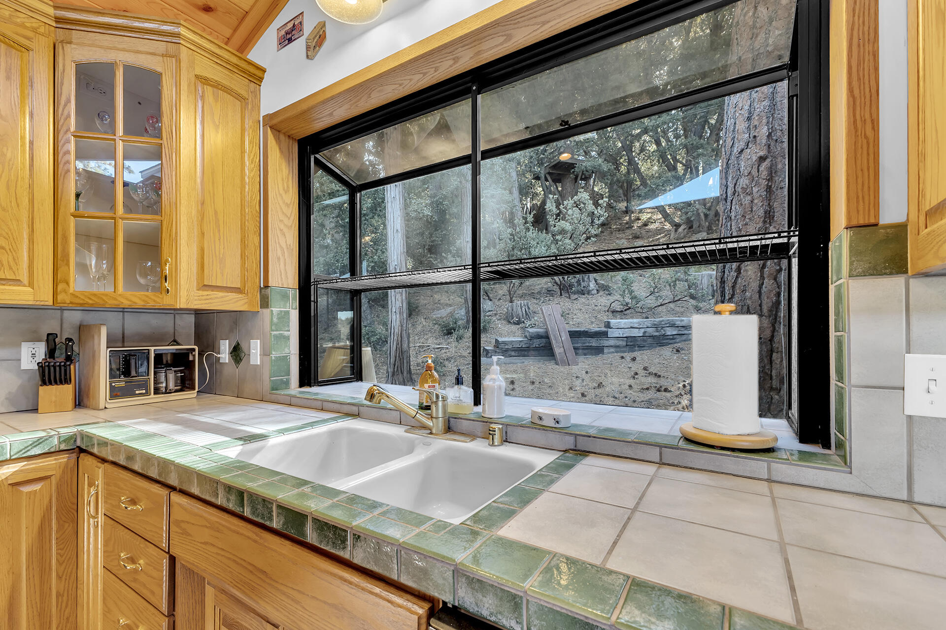 53071 Middleridge Drive Idyllwild, CA 92549 - Photo 18 of 50 a bathroom with a granite countertop sink and a large mirror
