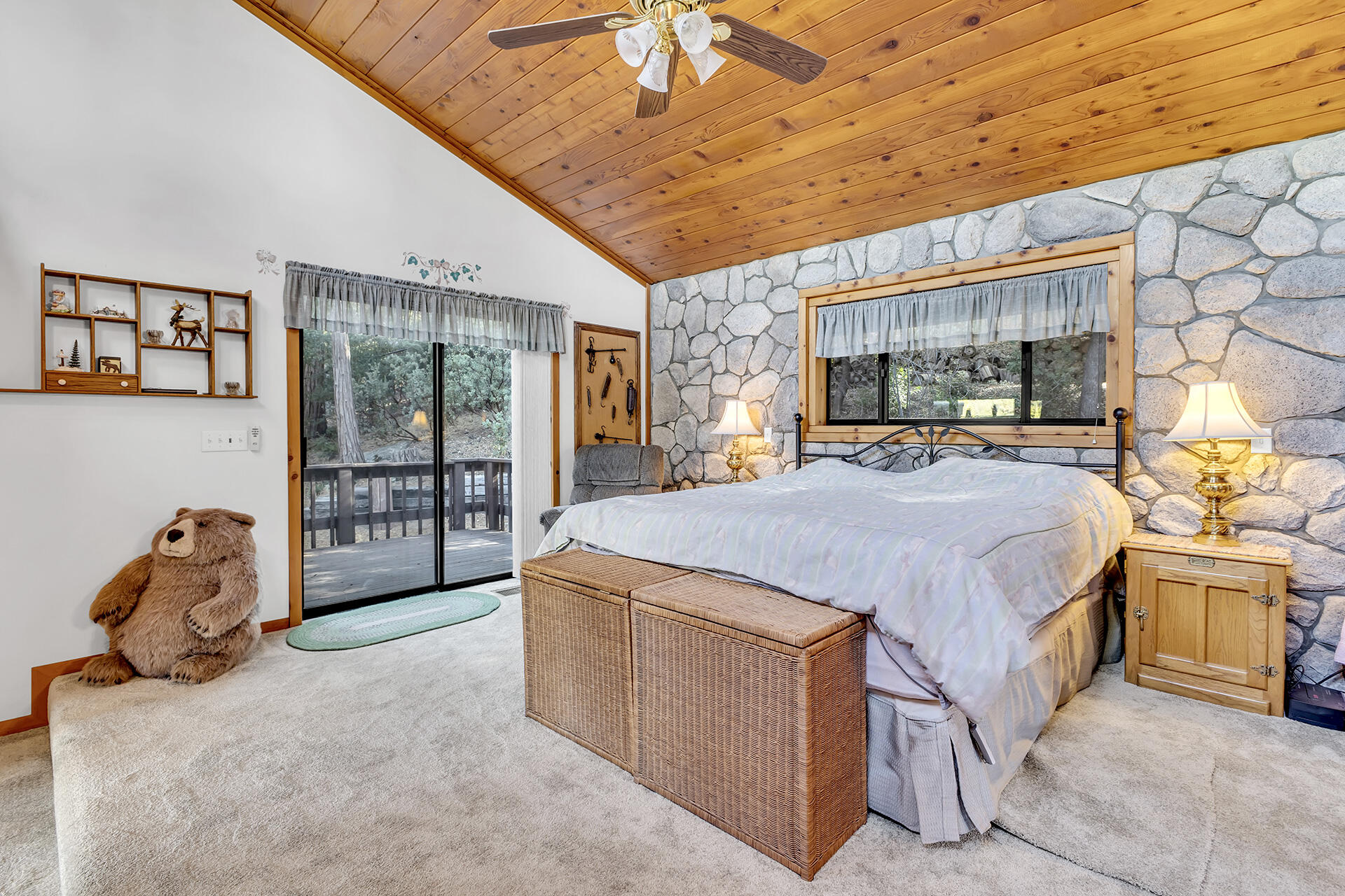 53071 Middleridge Drive Idyllwild, CA 92549 - Photo 23 of 50 a spacious bedroom with a bed and a dresser next to a window