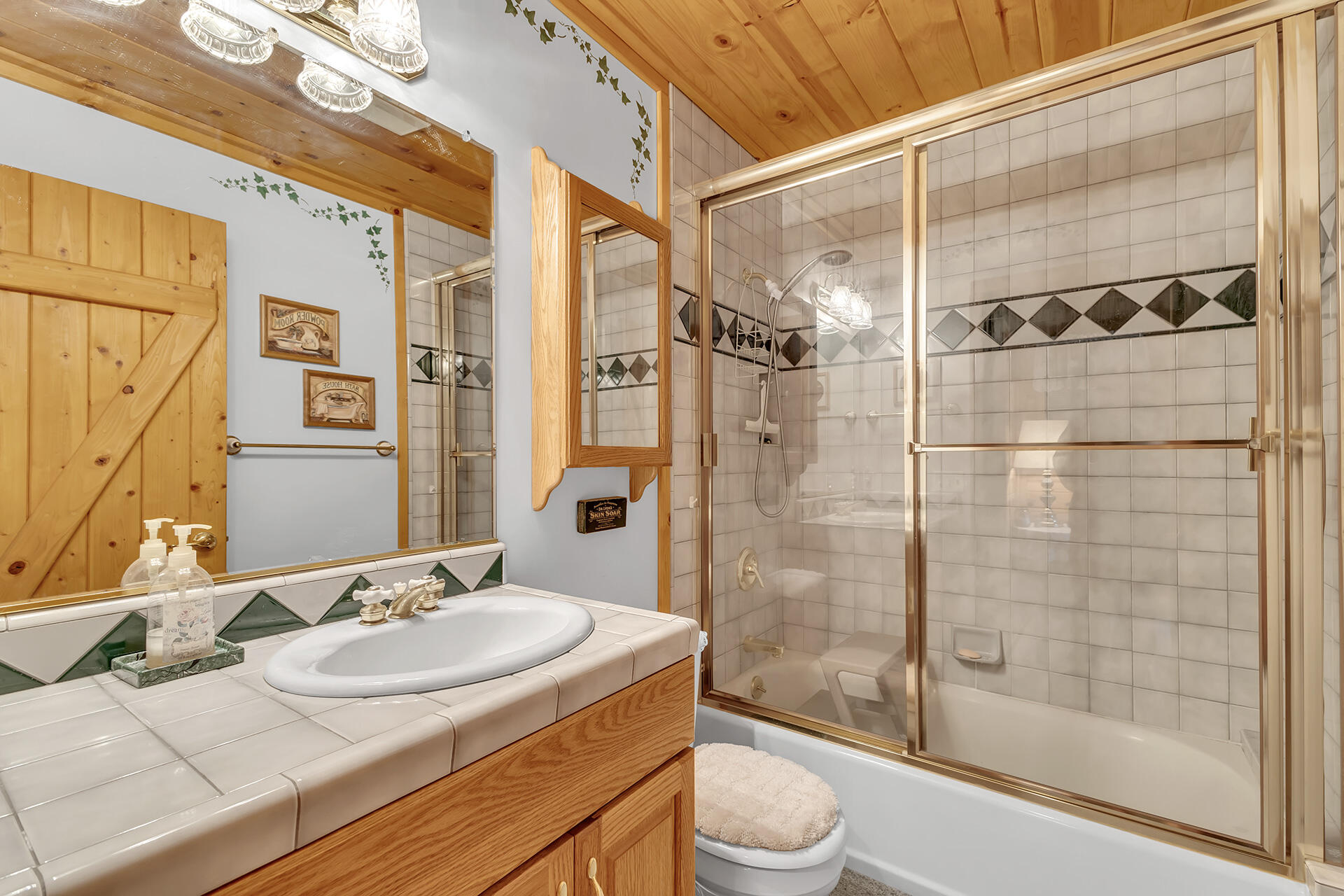 53071 Middleridge Drive Idyllwild, CA 92549 - Photo 35 of 50 a bathroom with a sink and a mirror