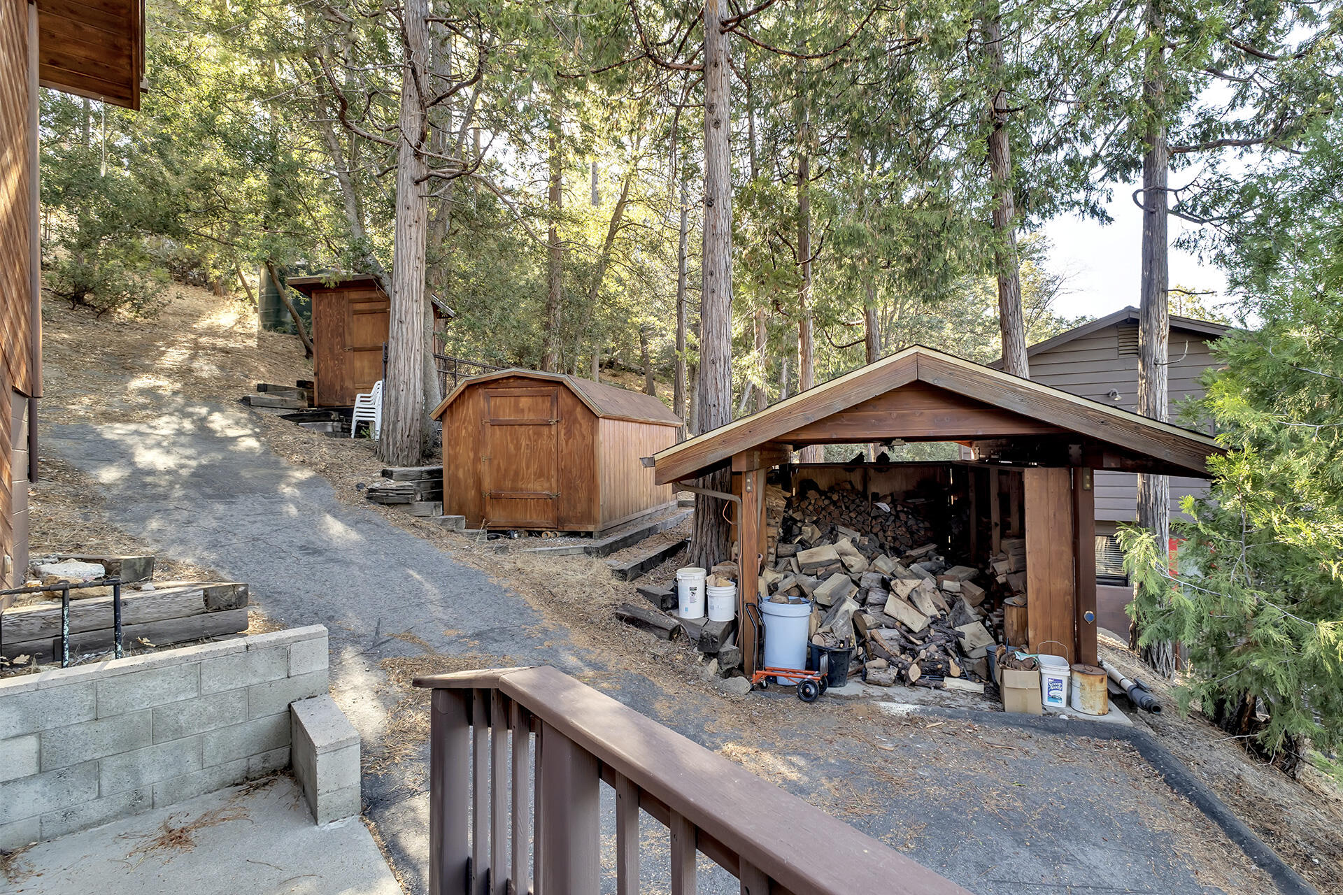 53071 Middleridge Drive Idyllwild, CA 92549 - Photo 7 of 50 a view of a wooden chairs and table in the patio
