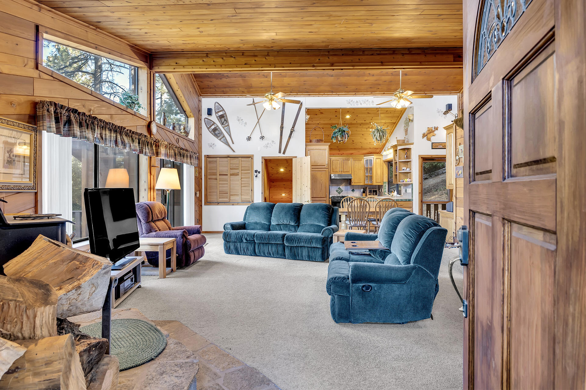 53071 Middleridge Drive Idyllwild, CA 92549 - Photo 8 of 50 a living room with furniture a fireplace and a large window