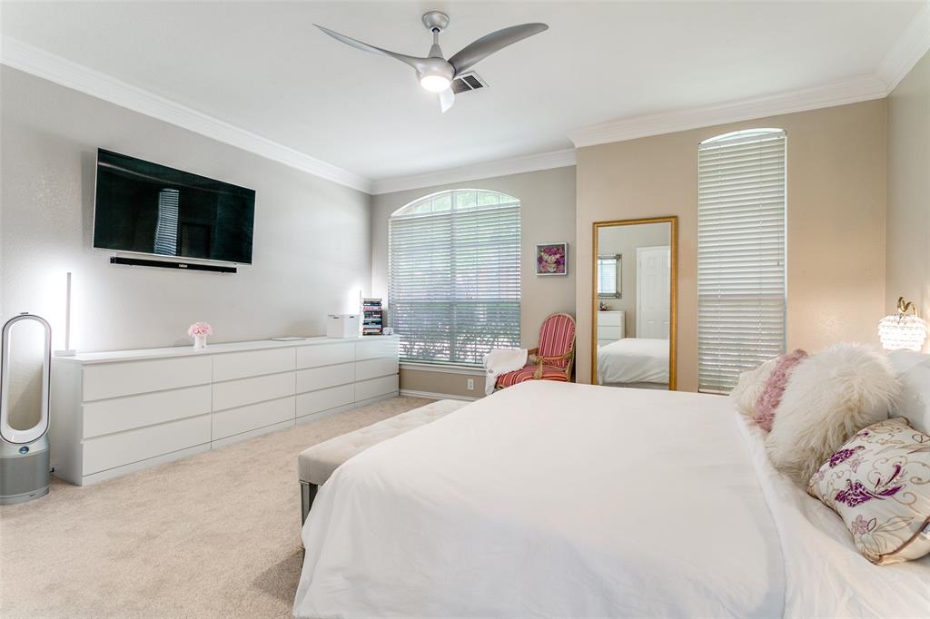 1509 Blue Mesa Road Carrollton, TX 75007 - Photo 19 of 35 a bedroom with a bed and a flat screen tv