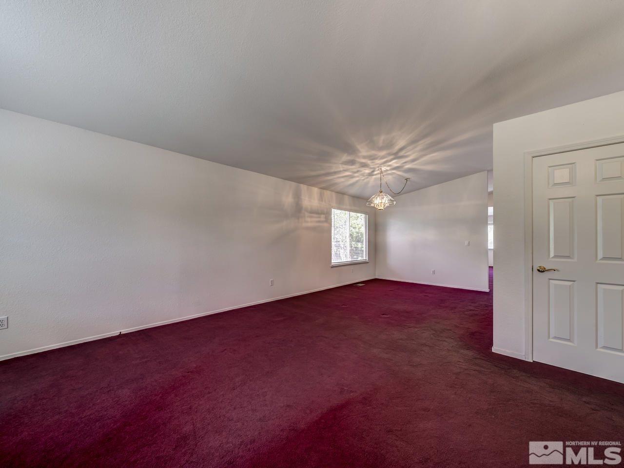 2035 Honey Ridge Drive Reno, NV 89511 - Photo 9 of 25 an empty room with windows and fan