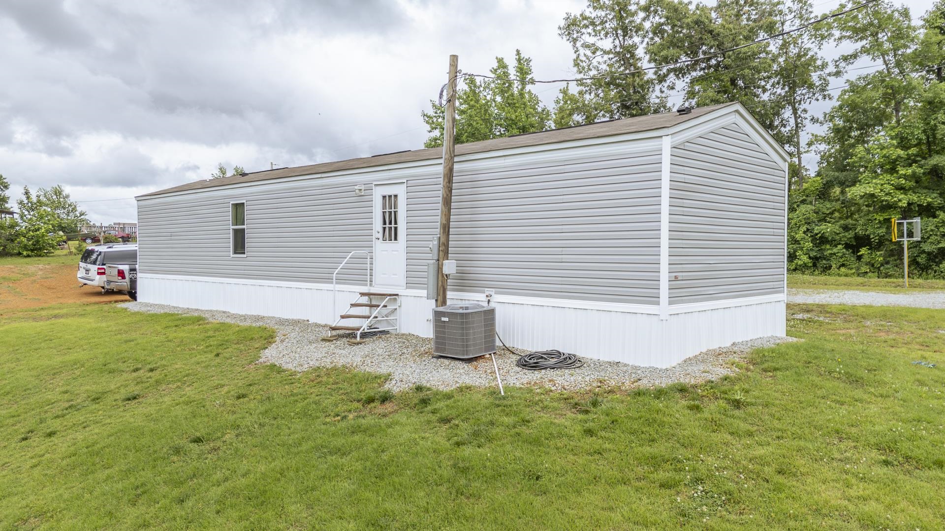 3275 Glendale Road Adamsville, TN 38310 - Photo 6 of 39 a backyard of a house with table and chairs