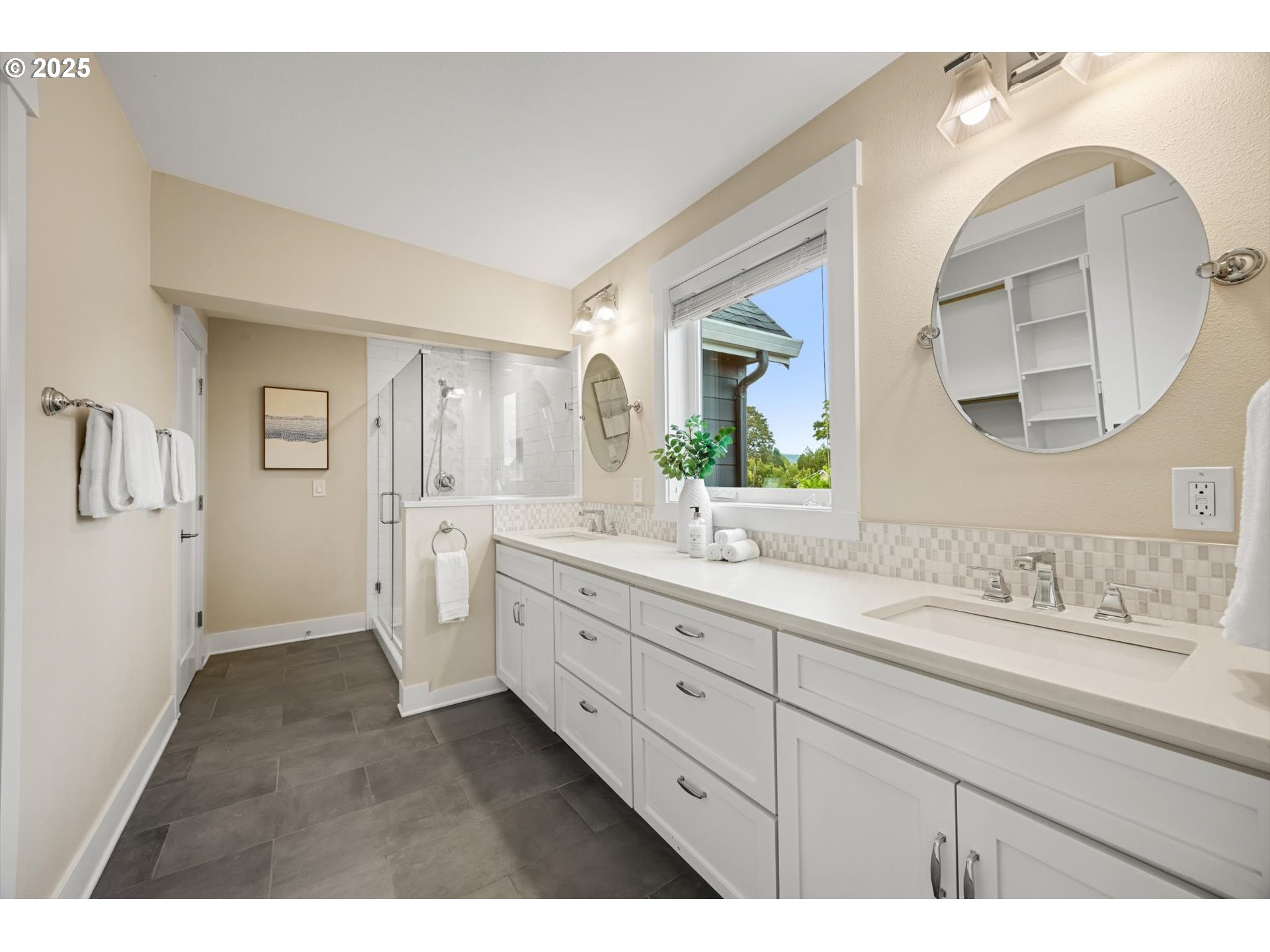 8623 Southeast 11th Avenue Portland, OR 97202 - Photo 22 of 46 a spacious bathroom with a double vanity sink and mirror with shower