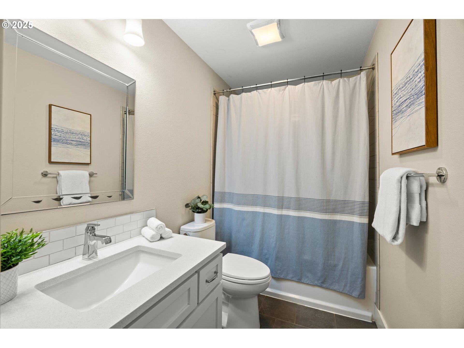 8623 Southeast 11th Avenue Portland, OR 97202 - Photo 26 of 46 a bathroom with a sink a toilet and mirror