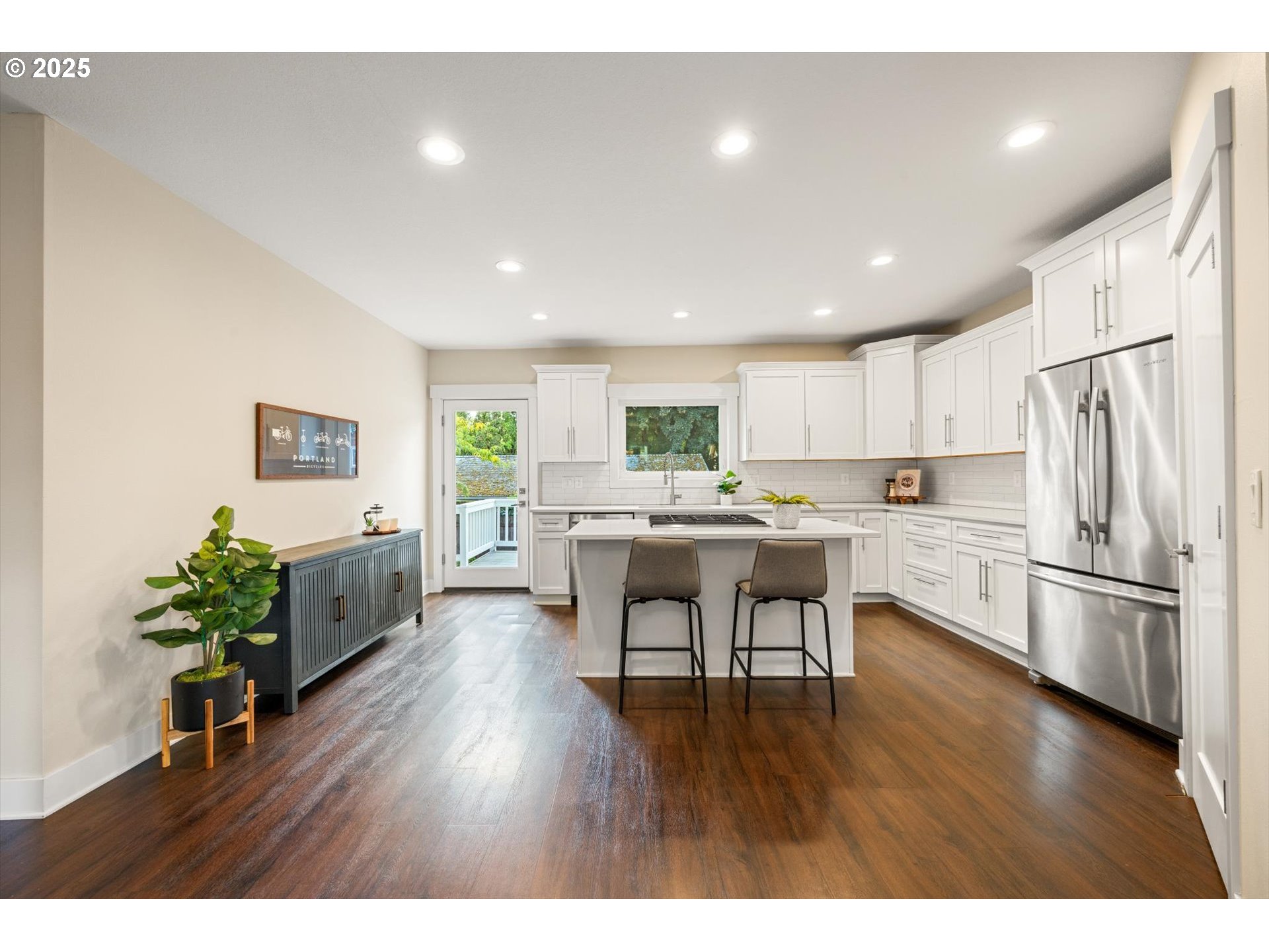 8623 Southeast 11th Avenue Portland, OR 97202 - Photo 4 of 46 a kitchen with a refrigerator and a dining table