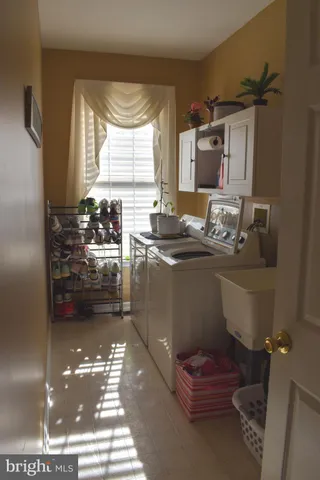 a bathroom with a sink toilet and window