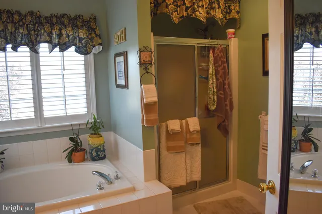 a bathroom with a tub and a sink