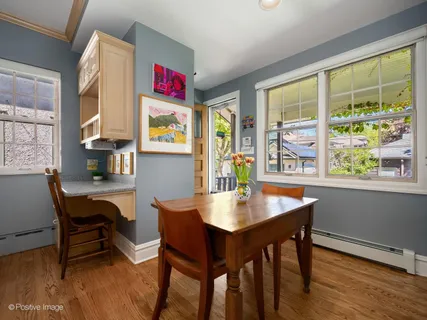 a view of a dining room with furniture and window