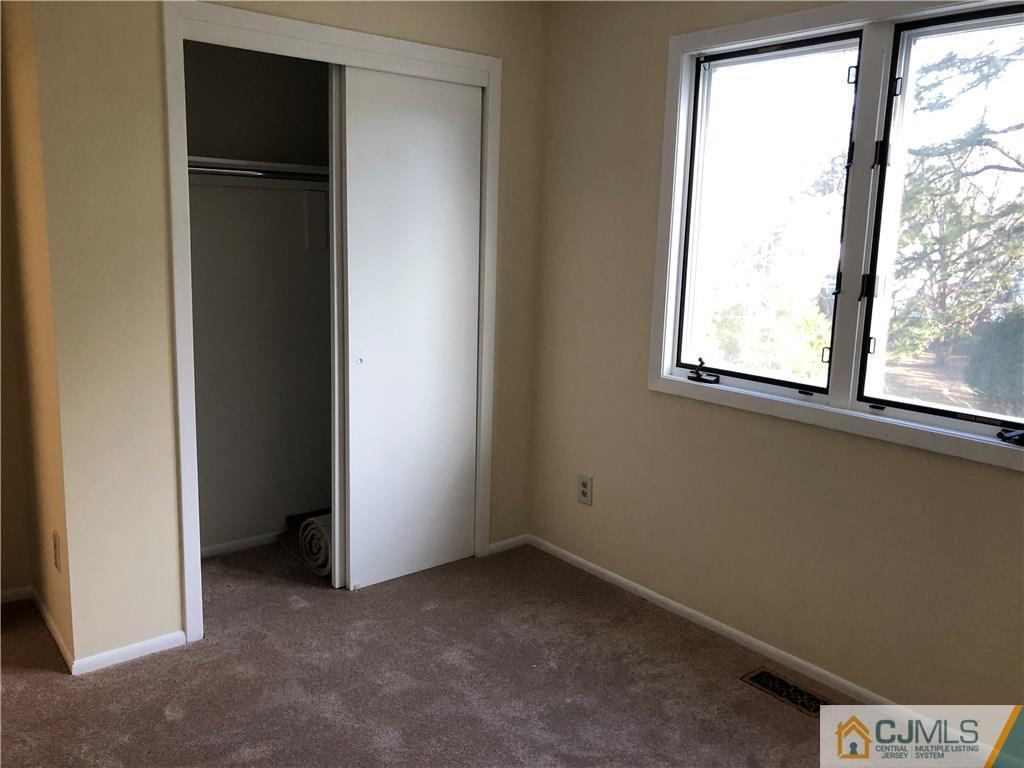 16 Shelly Road Old Bridge, NJ 08857 - Photo 14 of 25 an empty room with windows and closet