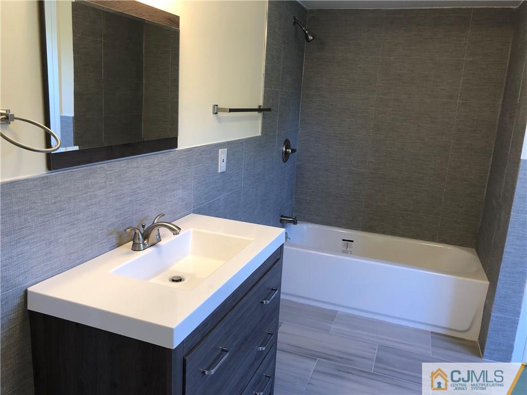 16 Shelly Road Old Bridge, NJ 08857 - Photo 17 of 25 a bathroom with a sink and a bathtub