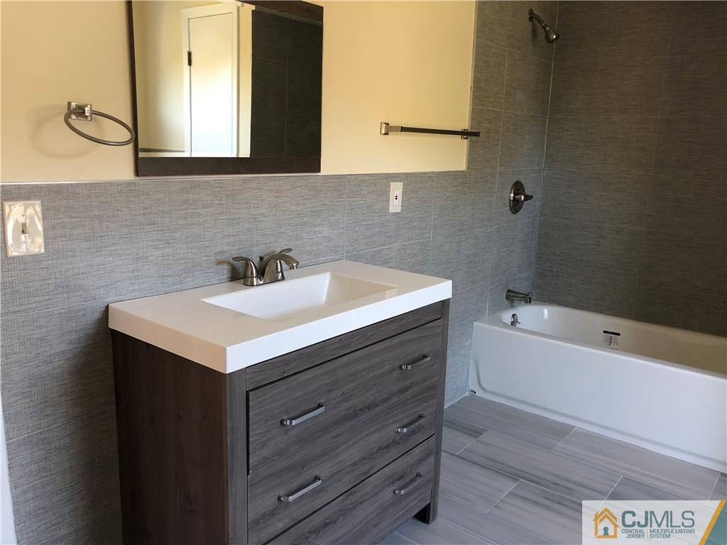 16 Shelly Road Old Bridge, NJ 08857 - Photo 19 of 25 a bathroom with a sink and a bathtub