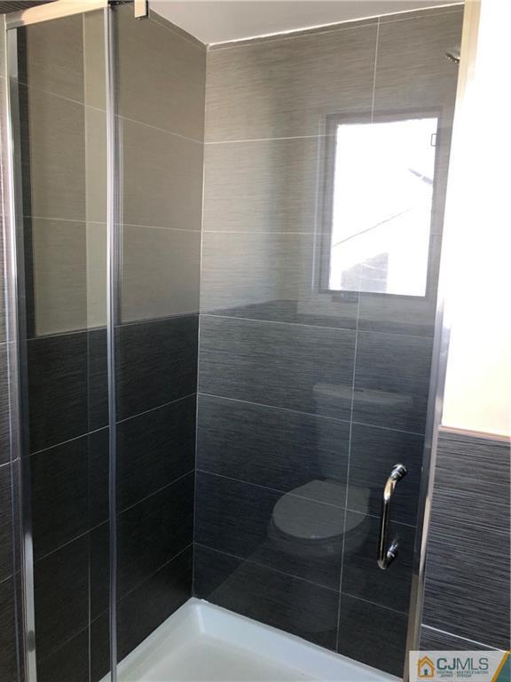 16 Shelly Road Old Bridge, NJ 08857 - Photo 21 of 25 a bathroom with a toilet a sink and window