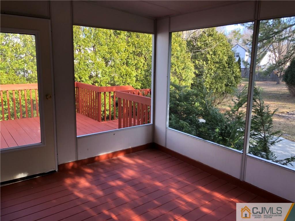 16 Shelly Road Old Bridge, NJ 08857 - Photo 23 of 25 a view of an empty room with wooden floor and a window