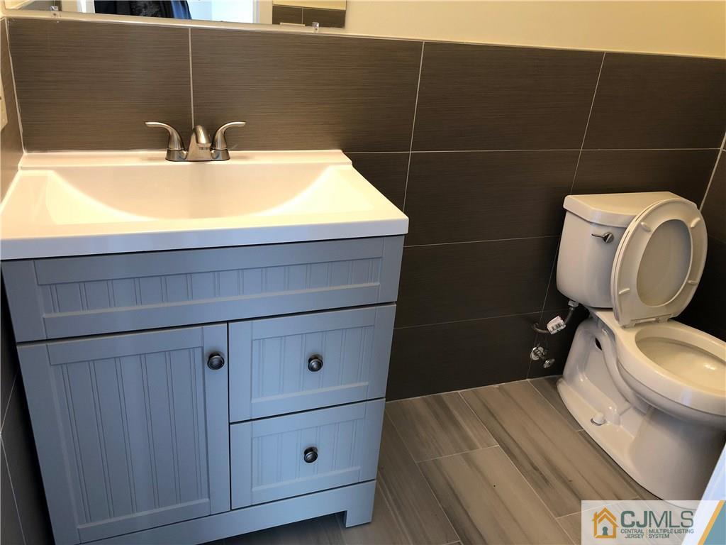 16 Shelly Road Old Bridge, NJ 08857 - Photo 6 of 25 a bathroom with a sink and a toilet