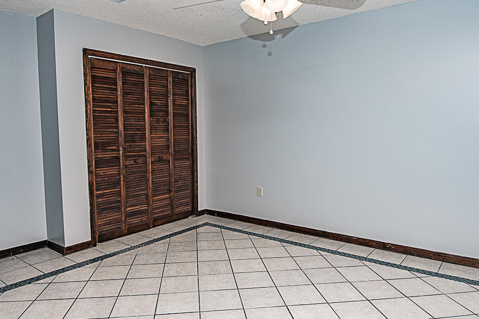 116 Walker Circle West Crestview, FL 32539 - Photo 12 of 20 a view of an empty room with windows