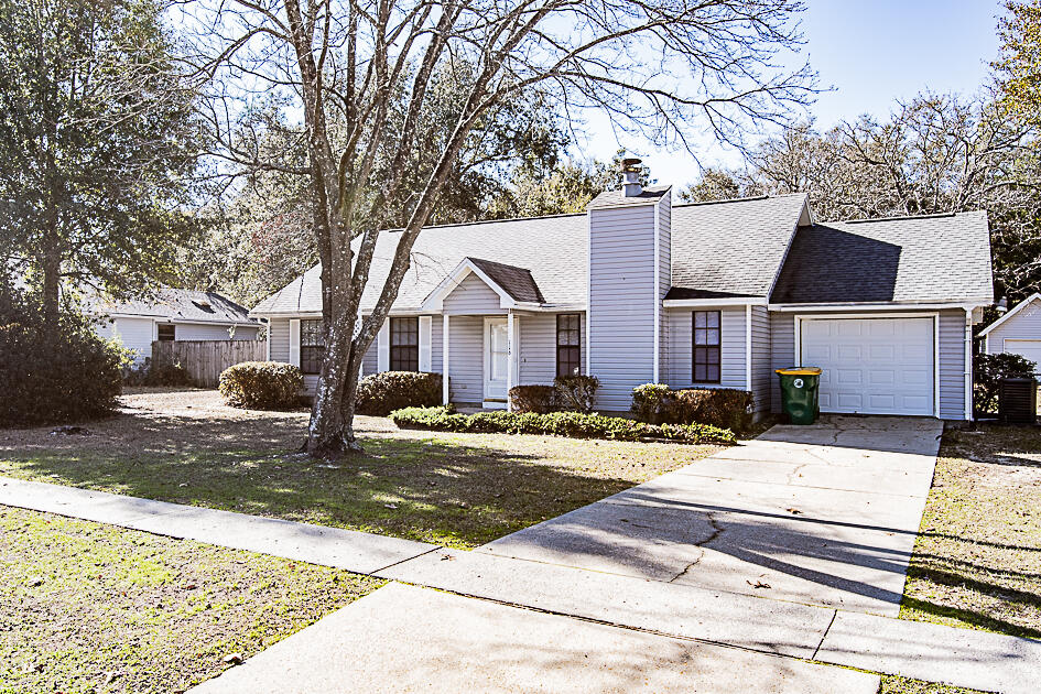 116 Walker Circle West Crestview, FL 32539 - Photo 20 of 20 a view of a white house with a large tree in front of it