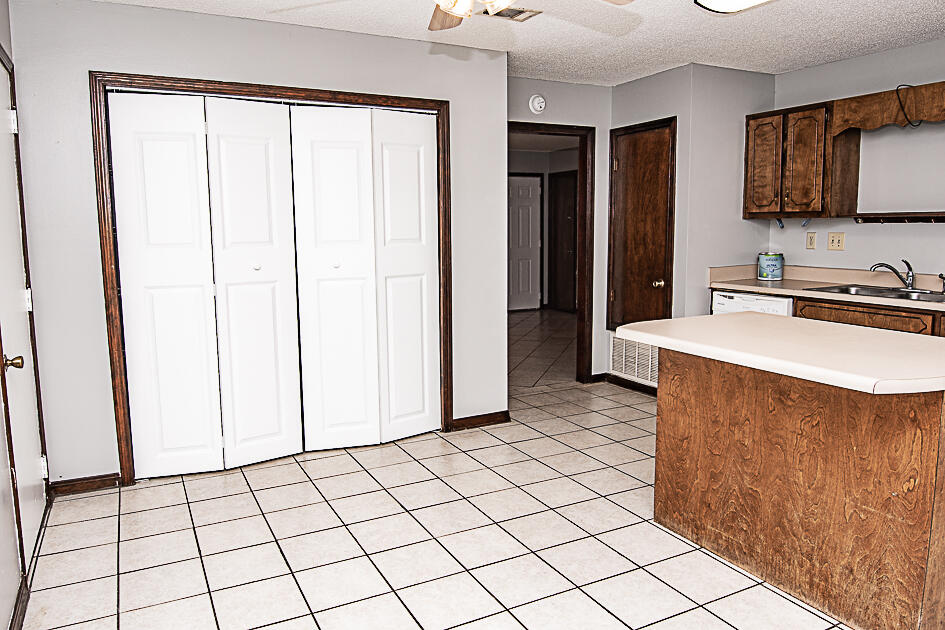 116 Walker Circle West Crestview, FL 32539 - Photo 6 of 20 a kitchen with stainless steel appliances a refrigerator sink and cabinets