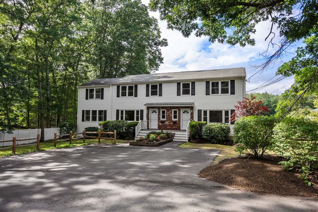 5 Old Central Turnpike Framingham, MA 01702 - Photo 1 of 32 a front view of a house with garden