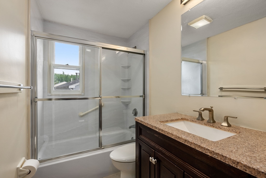 5 Old Central Turnpike Framingham, MA 01702 - Photo 12 of 32 a bathroom with a granite countertop sink toilet and shower