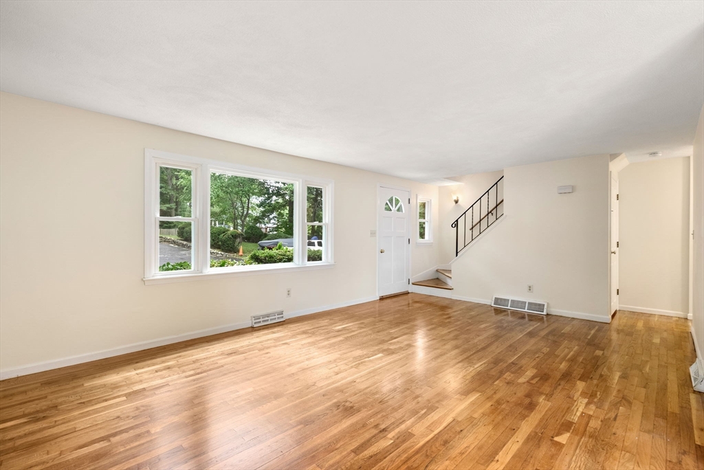 5 Old Central Turnpike Framingham, MA 01702 - Photo 18 of 32 a view of empty room with wooden floor and fan
