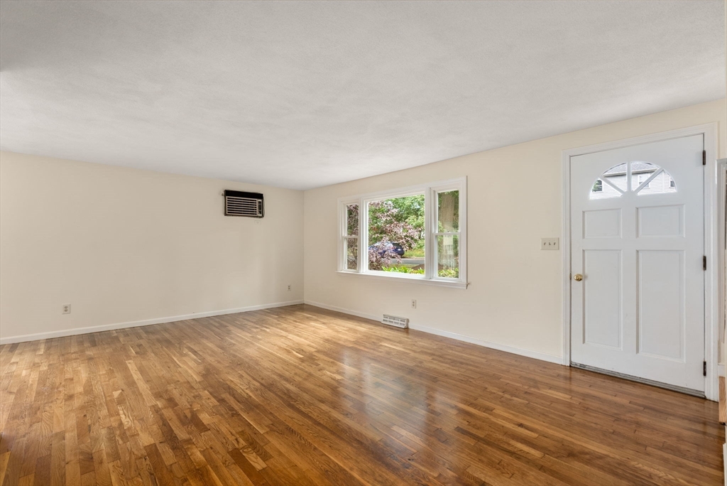 5 Old Central Turnpike Framingham, MA 01702 - Photo 19 of 32 an empty room with wooden floor and windows