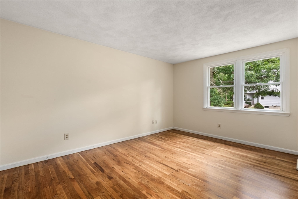 5 Old Central Turnpike Framingham, MA 01702 - Photo 26 of 32 an empty room with wooden floor and windows