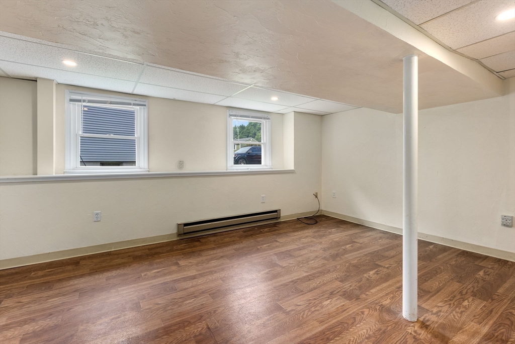 5 Old Central Turnpike Framingham, MA 01702 - Photo 29 of 32 an empty room with wooden floor and windows