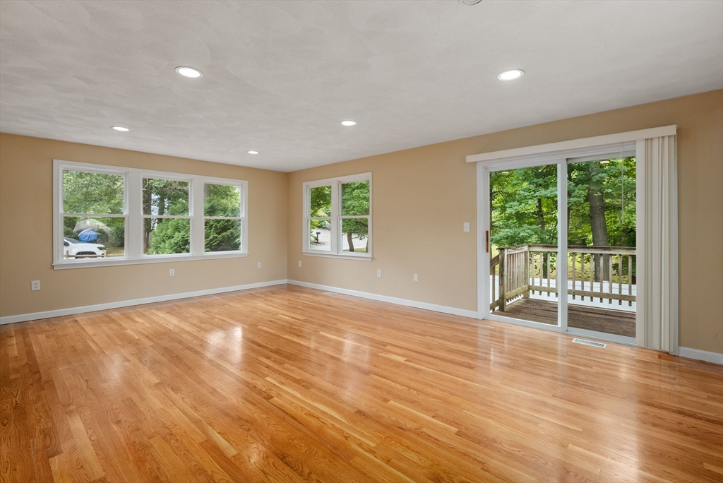 5 Old Central Turnpike Framingham, MA 01702 - Photo 4 of 32 a view of an empty room with wooden floor and a window