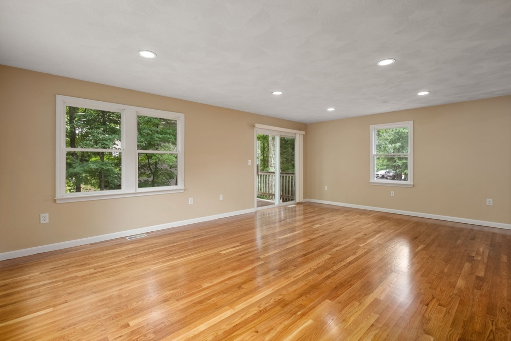 5 Old Central Turnpike Framingham, MA 01702 - Photo 5 of 32 a view of an empty room with wooden floor and a window