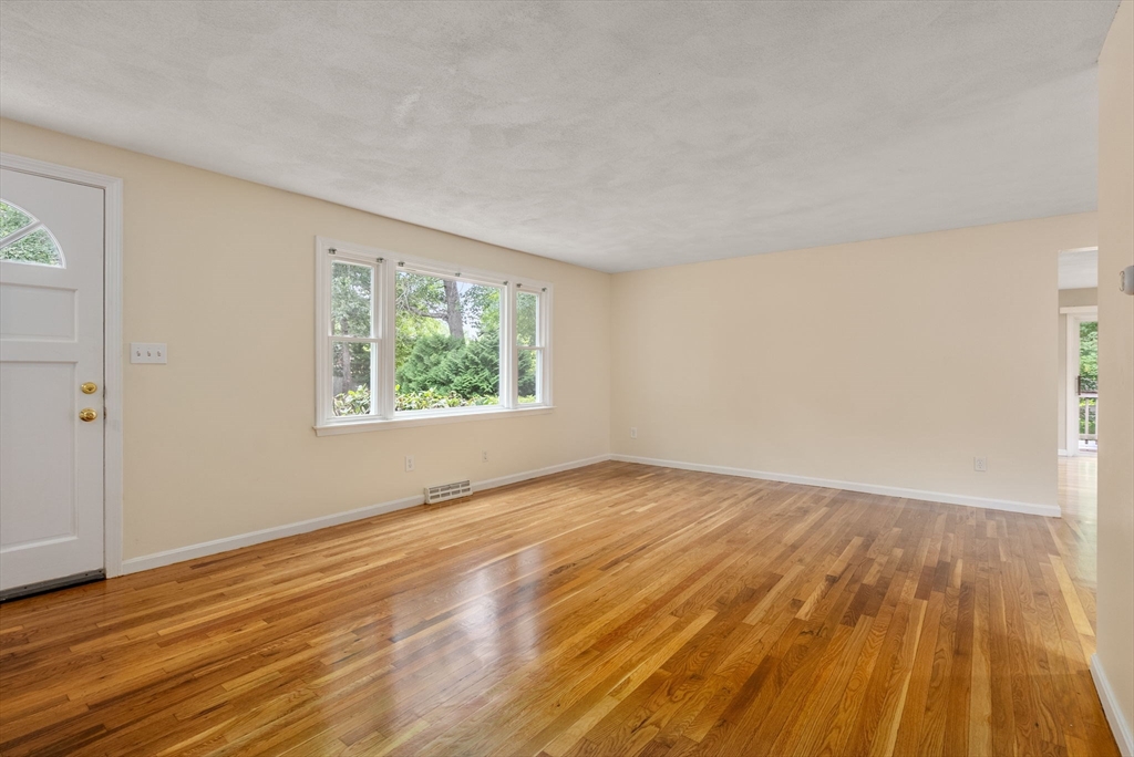 5 Old Central Turnpike Framingham, MA 01702 - Photo 7 of 32 a view of an empty room with wooden floor and a window