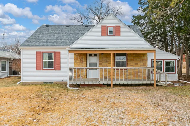 a house with trees in the background
