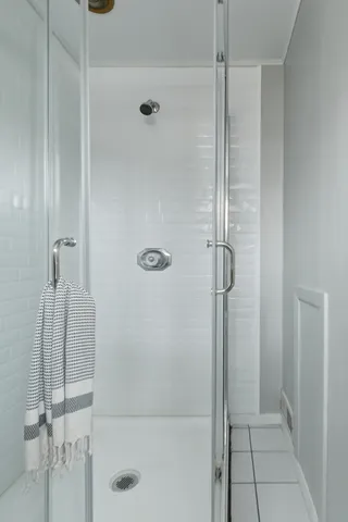 a view of an empty room with a fireplace