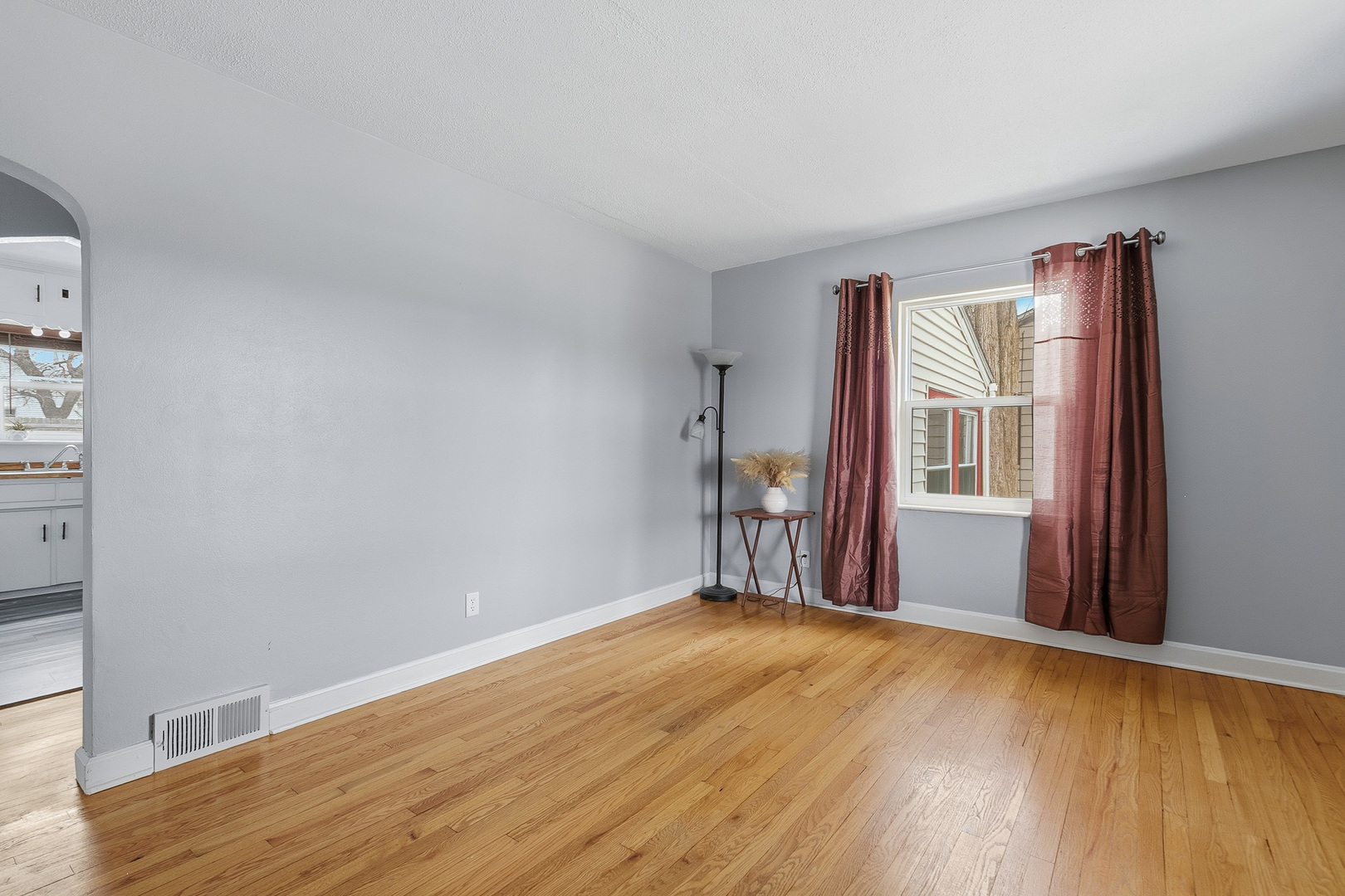 3237 12th Street Rock Island, IL 61201 - Photo 3 of 36 a view of empty room with wooden floor and fan