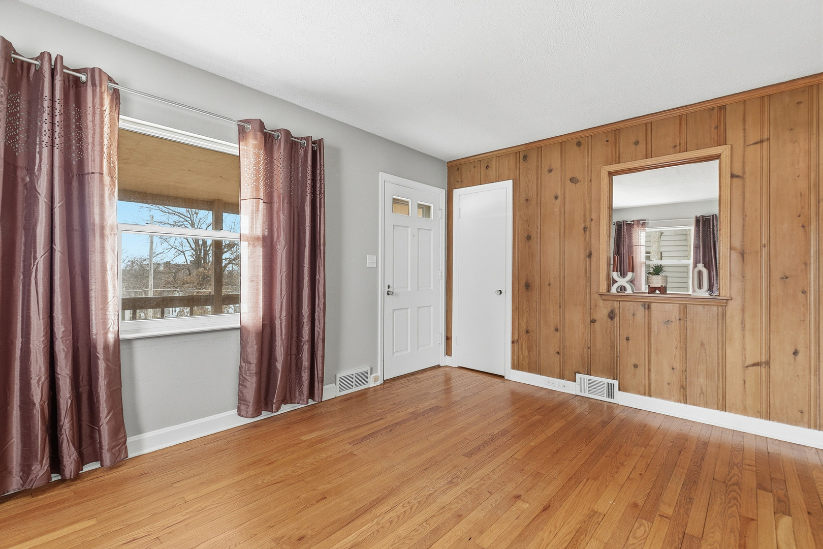3237 12th Street Rock Island, IL 61201 - Photo 6 of 36 a view of a livingroom with wooden floor and a bathroom
