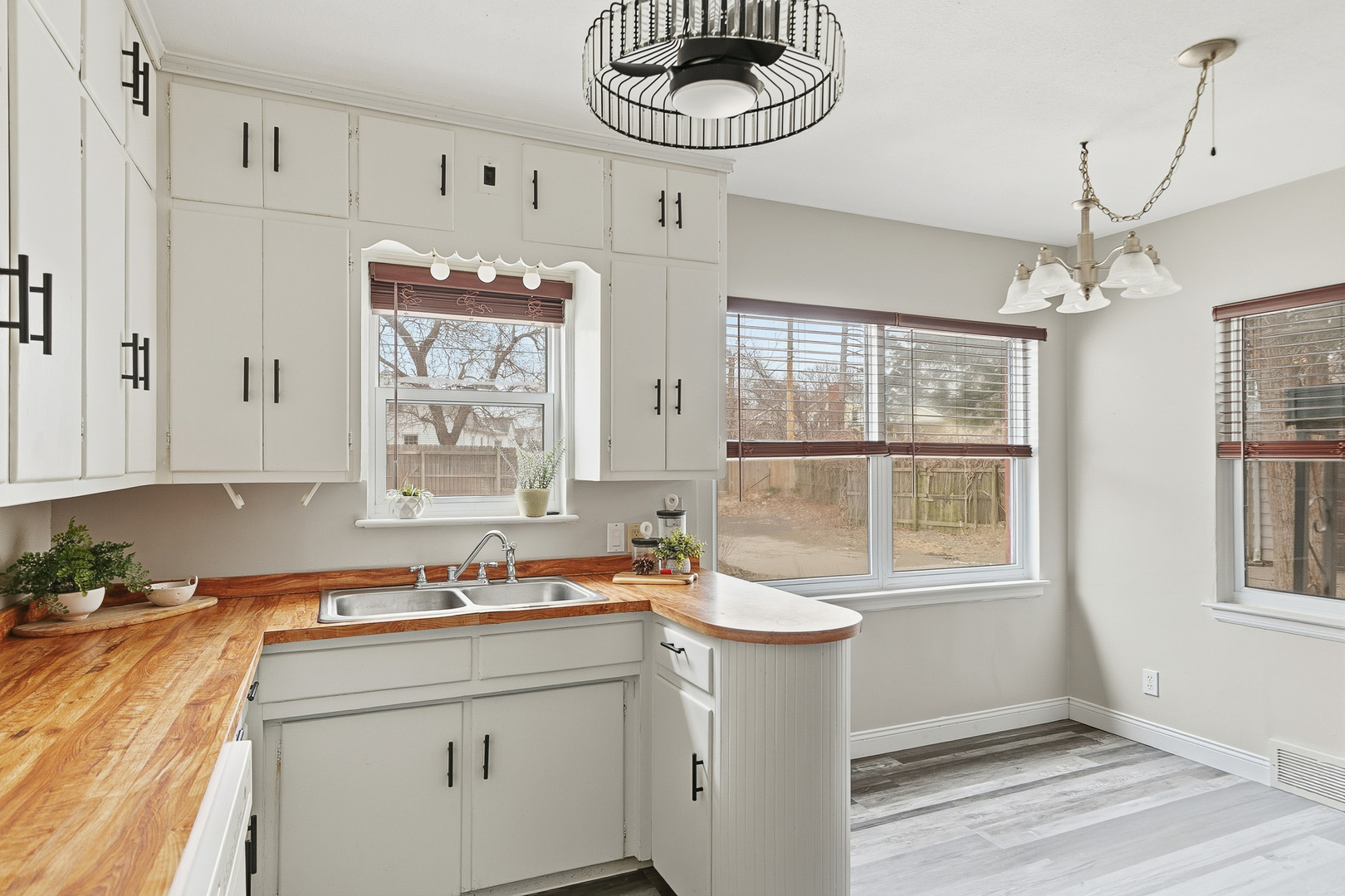 3237 12th Street Rock Island, IL 61201 - Photo 7 of 36 a bathroom with a sink a mirror and a window