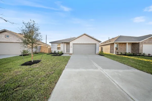 a front view of a house with yard