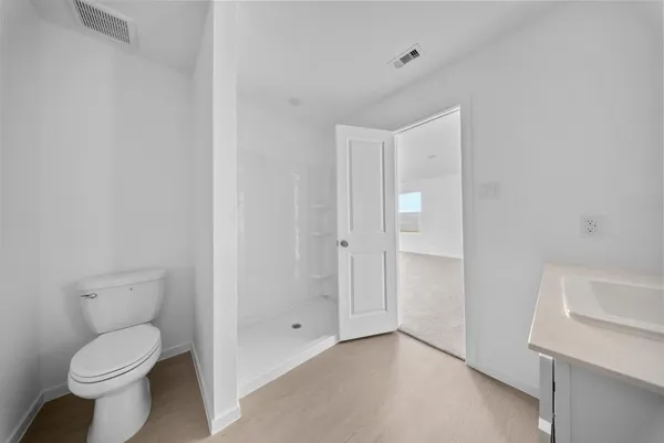 a bathroom with a toilet and a sink