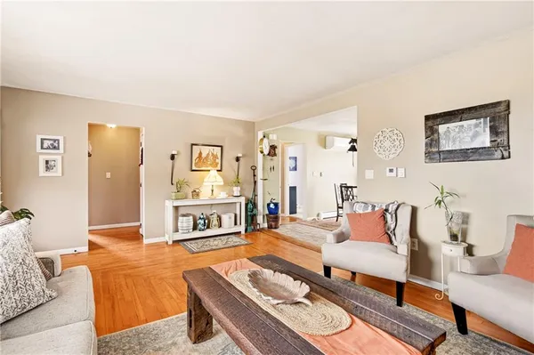 a kitchen with a table chairs stove and cabinets