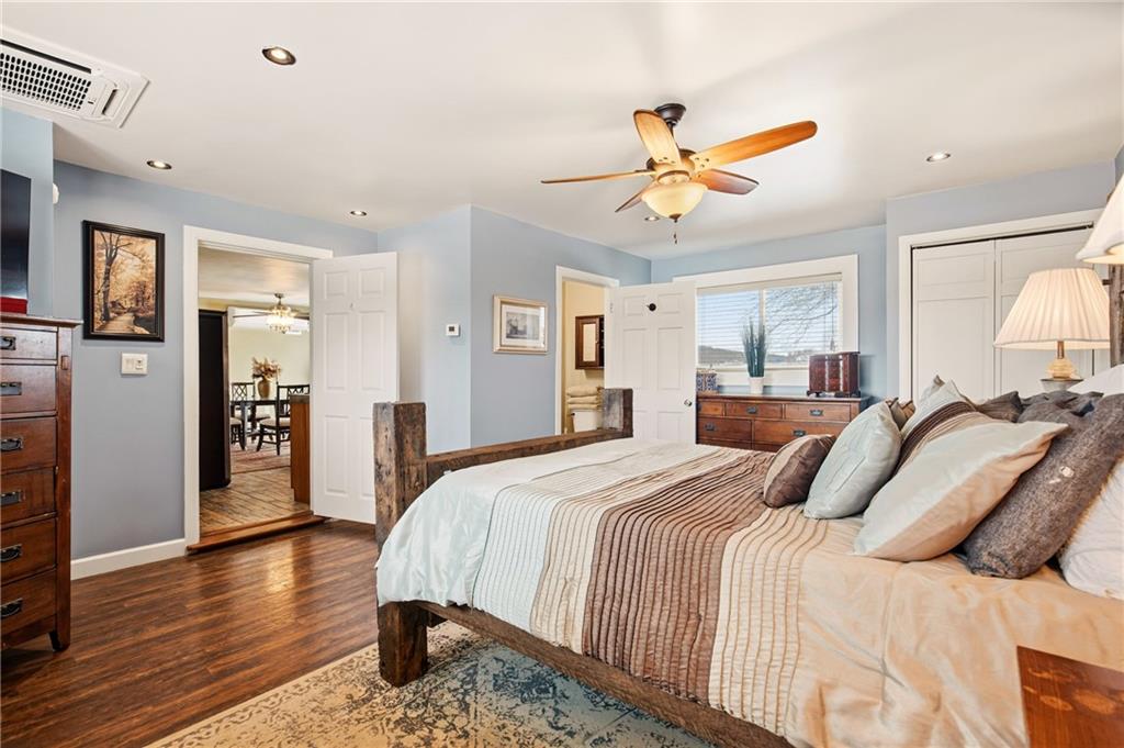 599 Brown Road Acme, PA 15610 - Photo 17 of 37 a bedroom with a bed and a chandelier