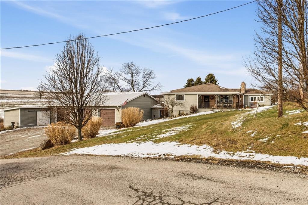 599 Brown Road Acme, PA 15610 - Photo 2 of 37 a front view of a house with a yard