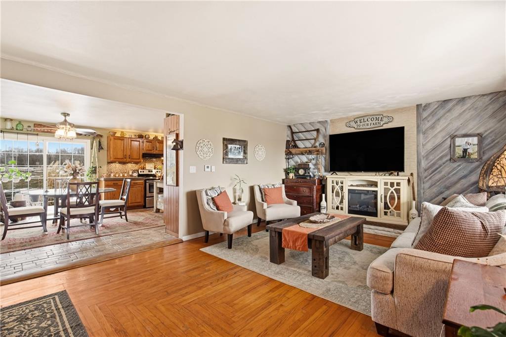 599 Brown Road Acme, PA 15610 - Photo 10 of 37 a living room with furniture and a flat screen tv