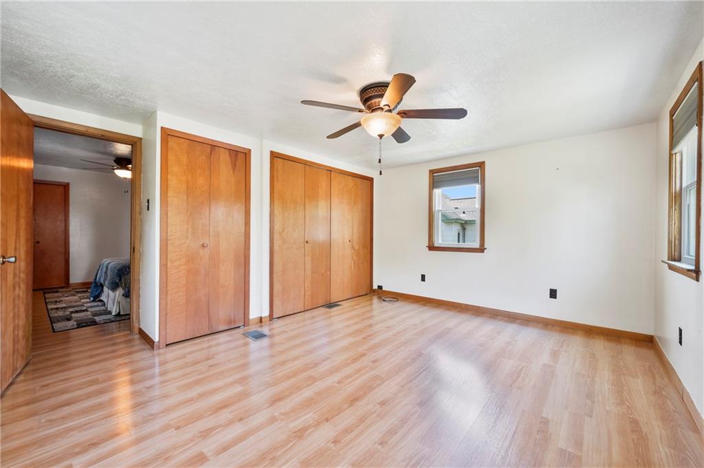 756 Mary Street McKees Rocks, PA 15136 - Photo 24 of 35 a view of room with wooden floor and ceiling fan