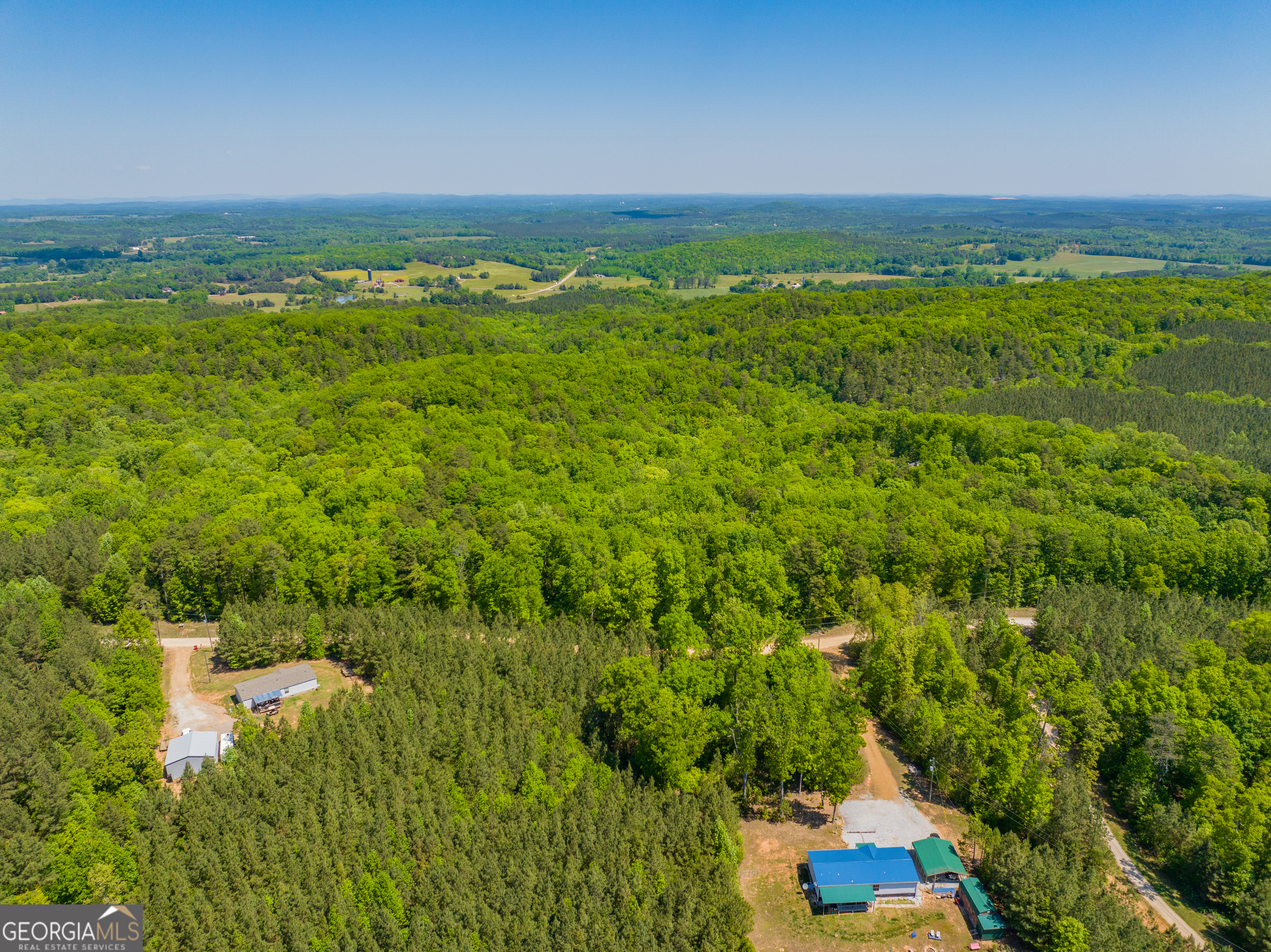 16-acres Gun Club Road Buchanan, GA 30113 - Photo 6 of 16 a view of a green field with an ocean view