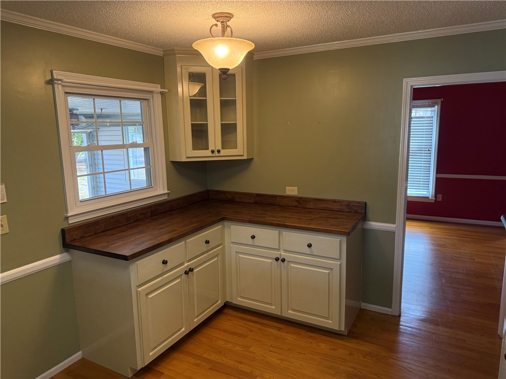 121 Nautical Way Anderson, SC 29625 - Photo 18 of 37 An inviting kitchen corner with natural wood countertops and bright cabinetry awaits culinary endeavors.