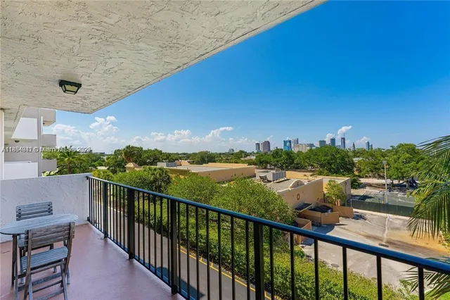 a view of a balcony with city view